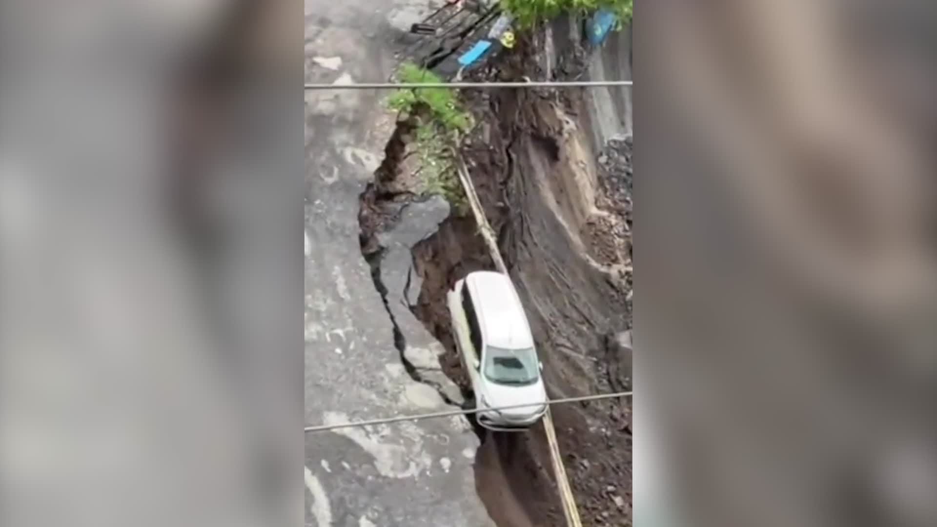 Van Tumbles Down Washed Out Road Videos from The Weather Channel