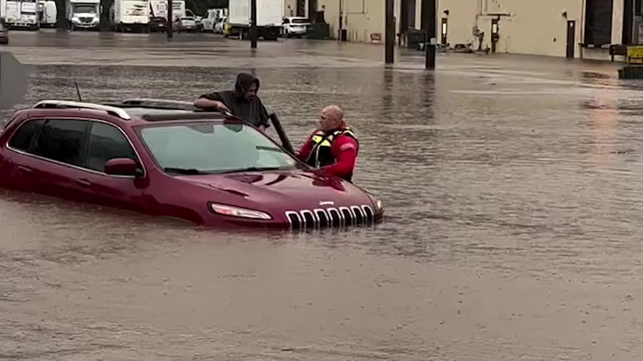 Officer Carries Driver Through Floodwaters - Videos from The Weather ...