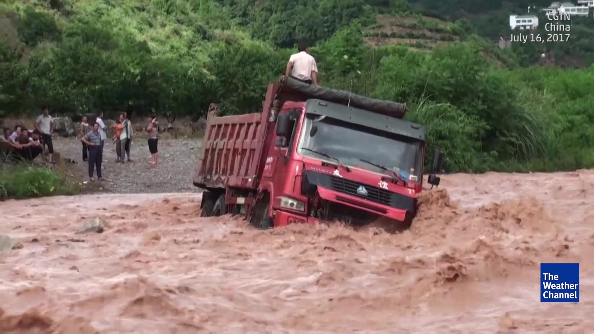 Rescuers Brave Raging River For Stranded Men