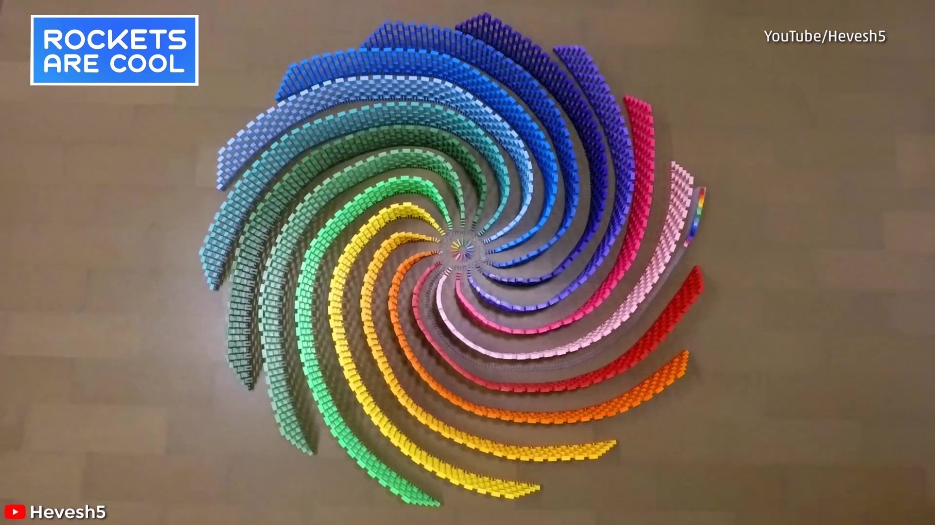 Domino Artists Create Rainbow Spiral