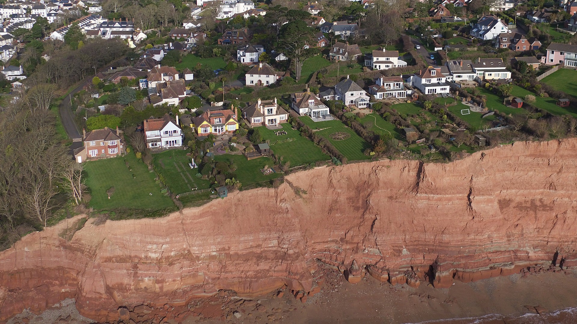 Erosion Threatens Expensive Homes on Cliff Road in Devon, Britain