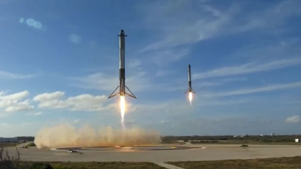 Boosters Return Safely to Earth After Launch of SpaceX Falcon Heavy